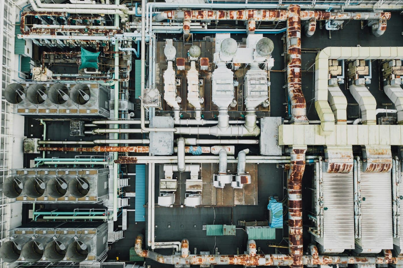 An industrial plant photographed straight down, pipework and machinery in rows