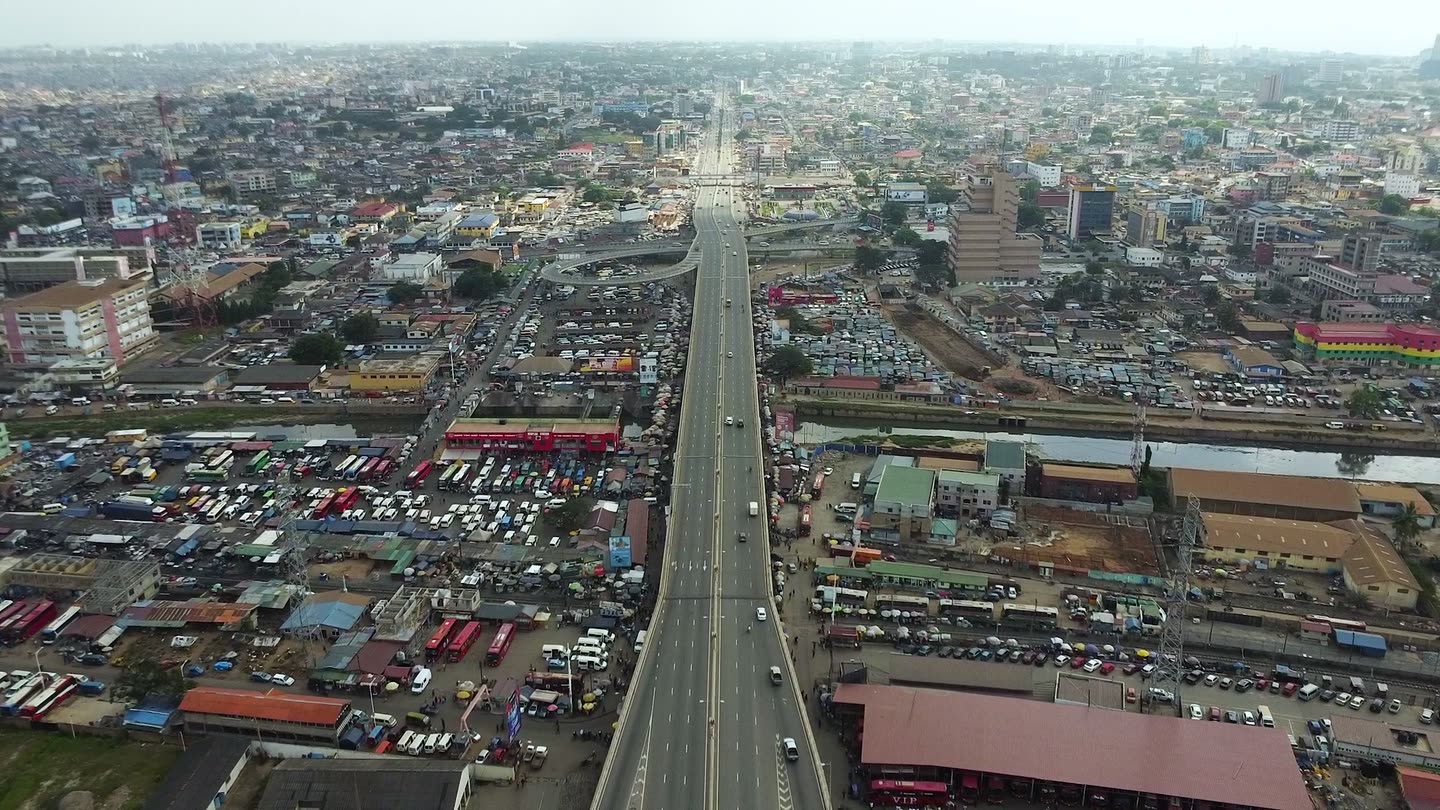 A multi-lane trunk road running through Accra, seen from the air